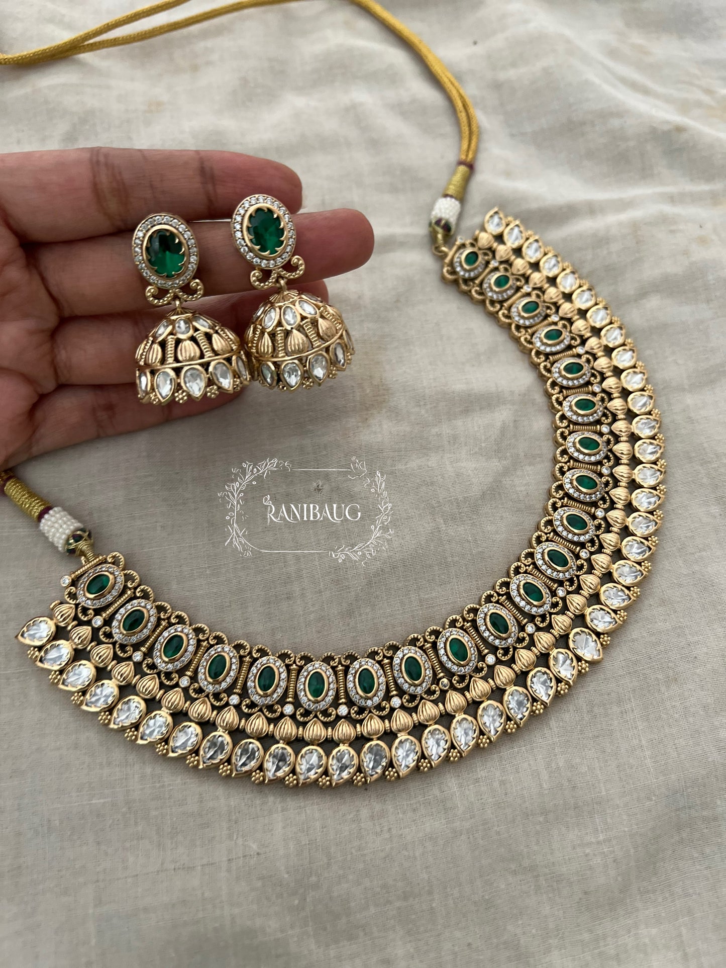 Rashi Round Polki Kundan Studded In Matt Gold Finish With Jhumka Heritage Necklace Set By Ranibaug