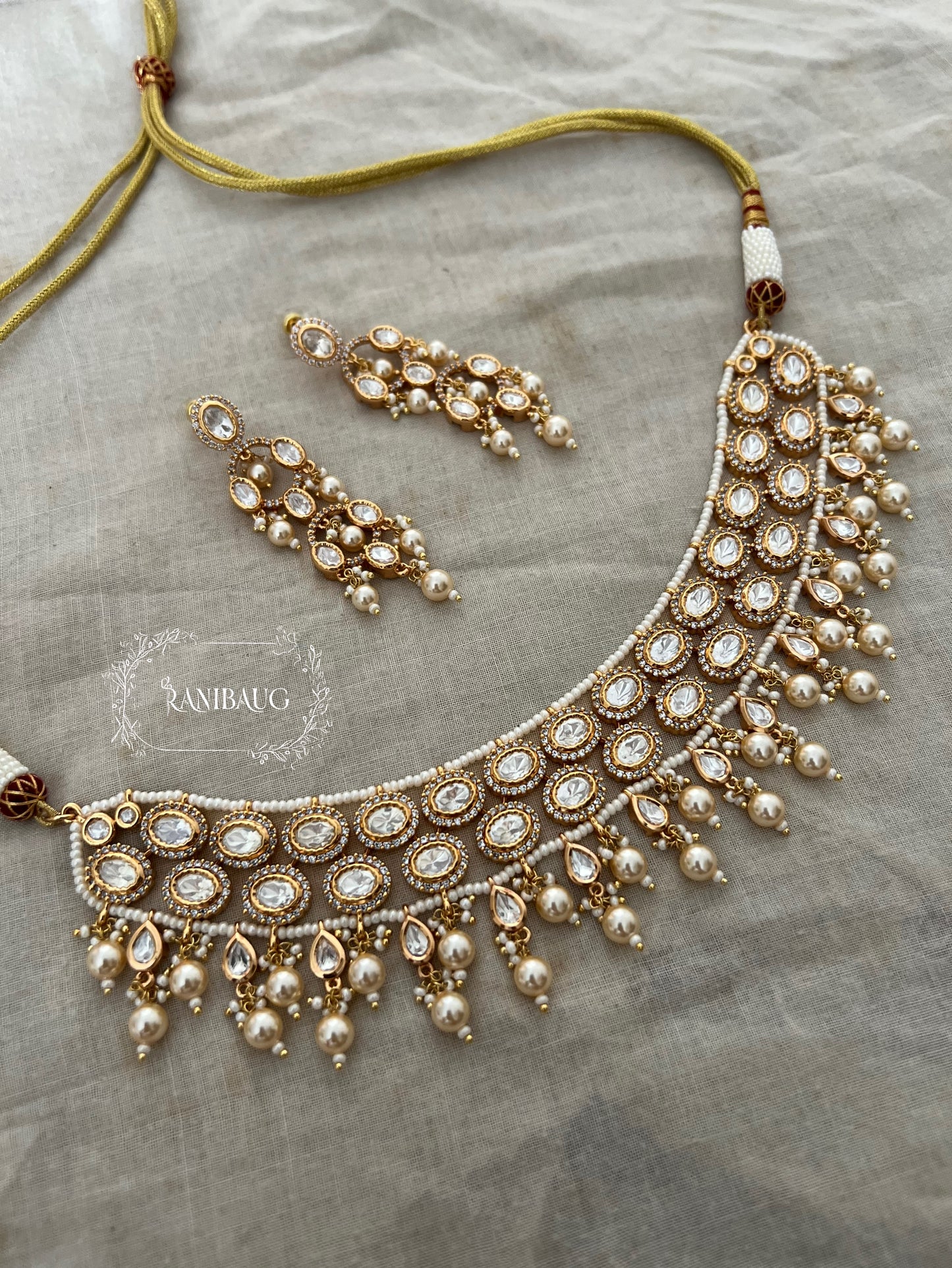 Revani Rich Gold Finish Polki Studded Pearl Fringe Necklace Set By Ranibaug