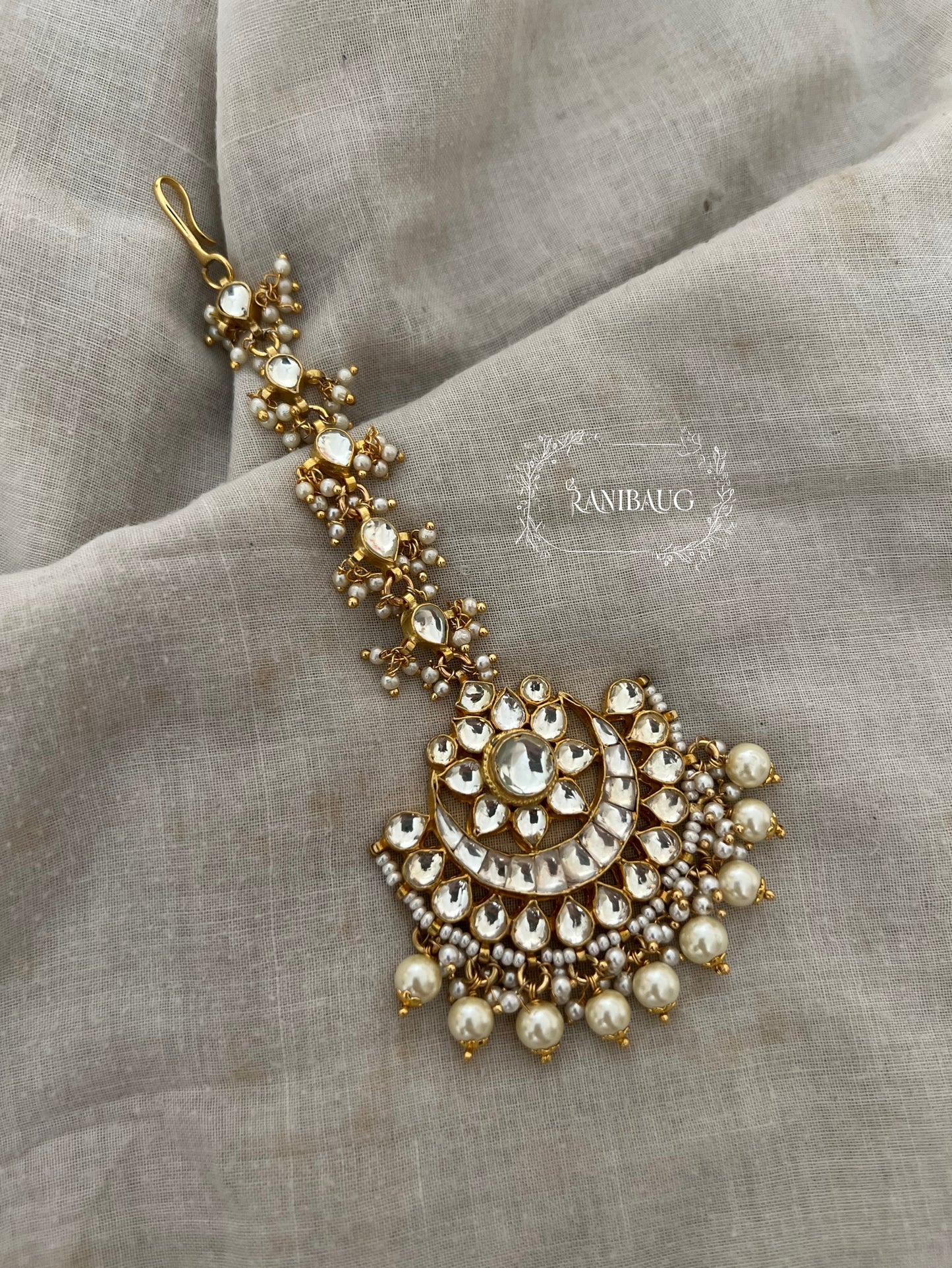 Richa Unique Moon Inspired Polki Kundan Studded Maangtikka In Premium Gold Finish By Ranibaug | Trendy Maang Tikka Jewellery For Wedding 2026