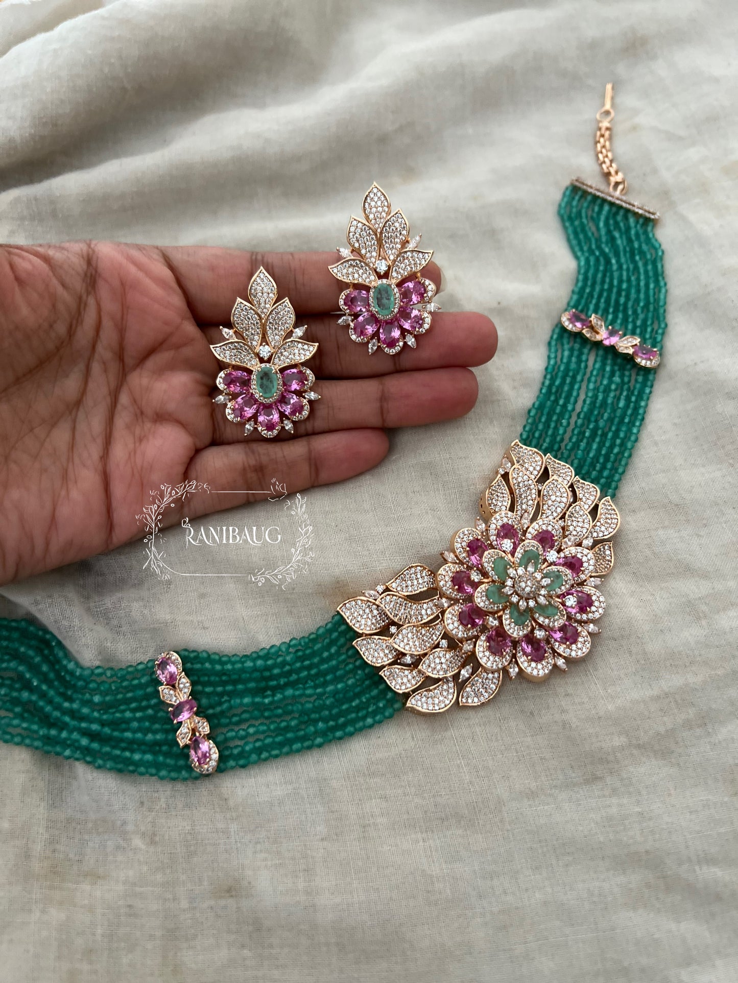 Rihana Traditional Emerald Beaded Pink Stones Gold Finish Diamond Jewellery Set By Ranibaug