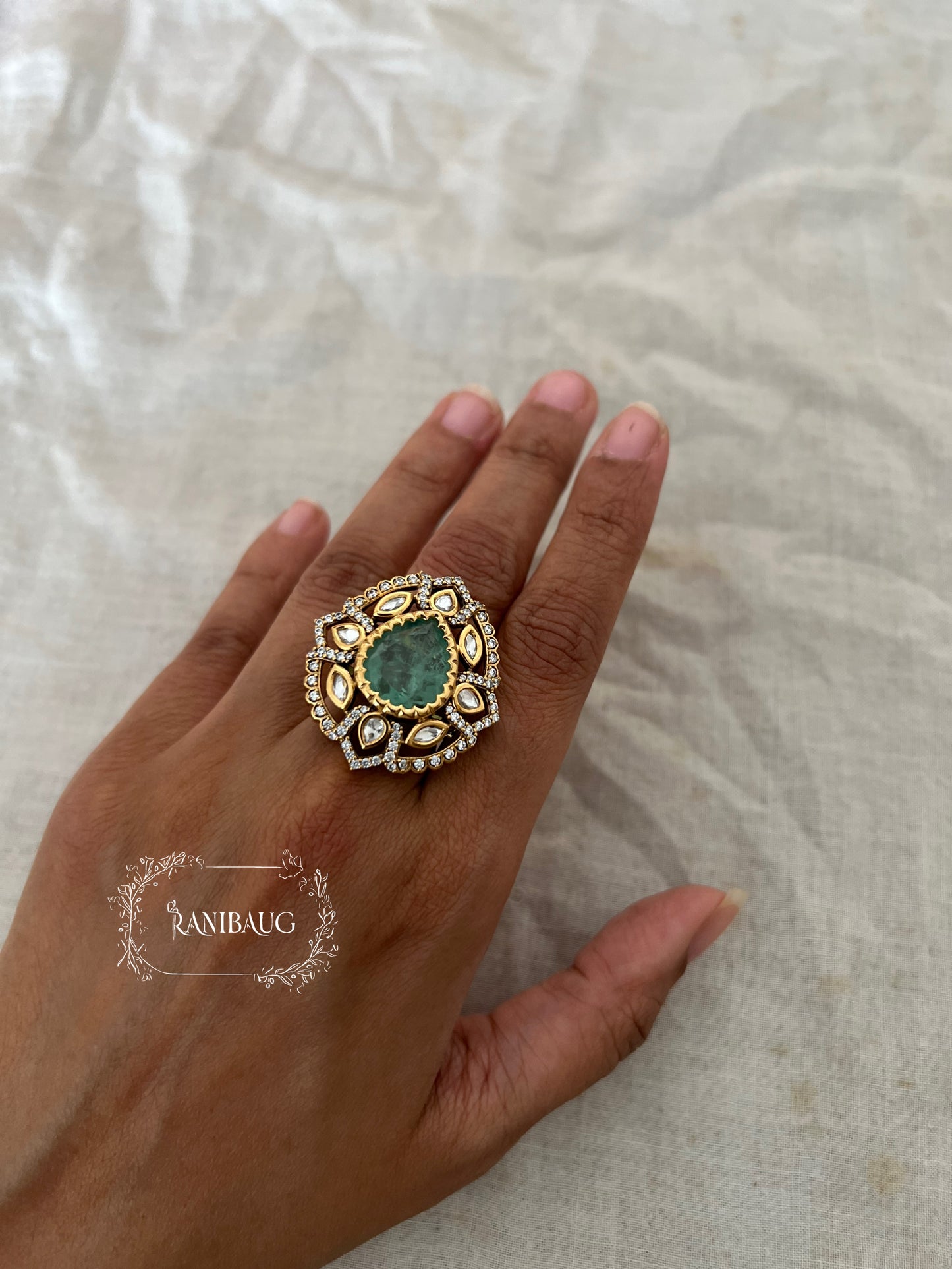Saira Teardrop Motif Ring In Matt Royal Tone Stones Outlined With Polki And Zirconnia In Rich Gold Finish By Ranibaug