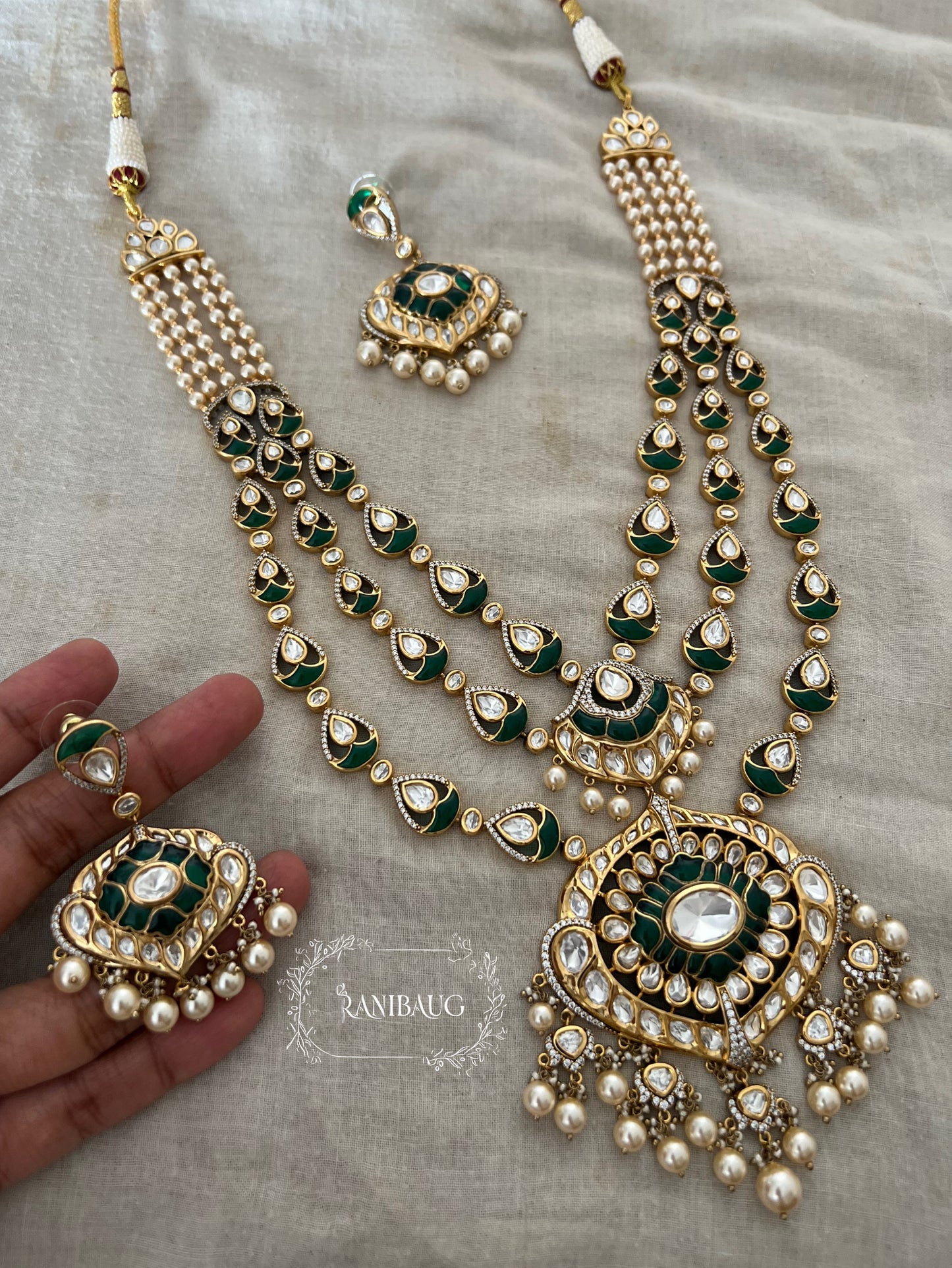 Salonee Green Layered Polki Studded Long Necklace Set Adorned With Creamy Pearls By Ranibaug