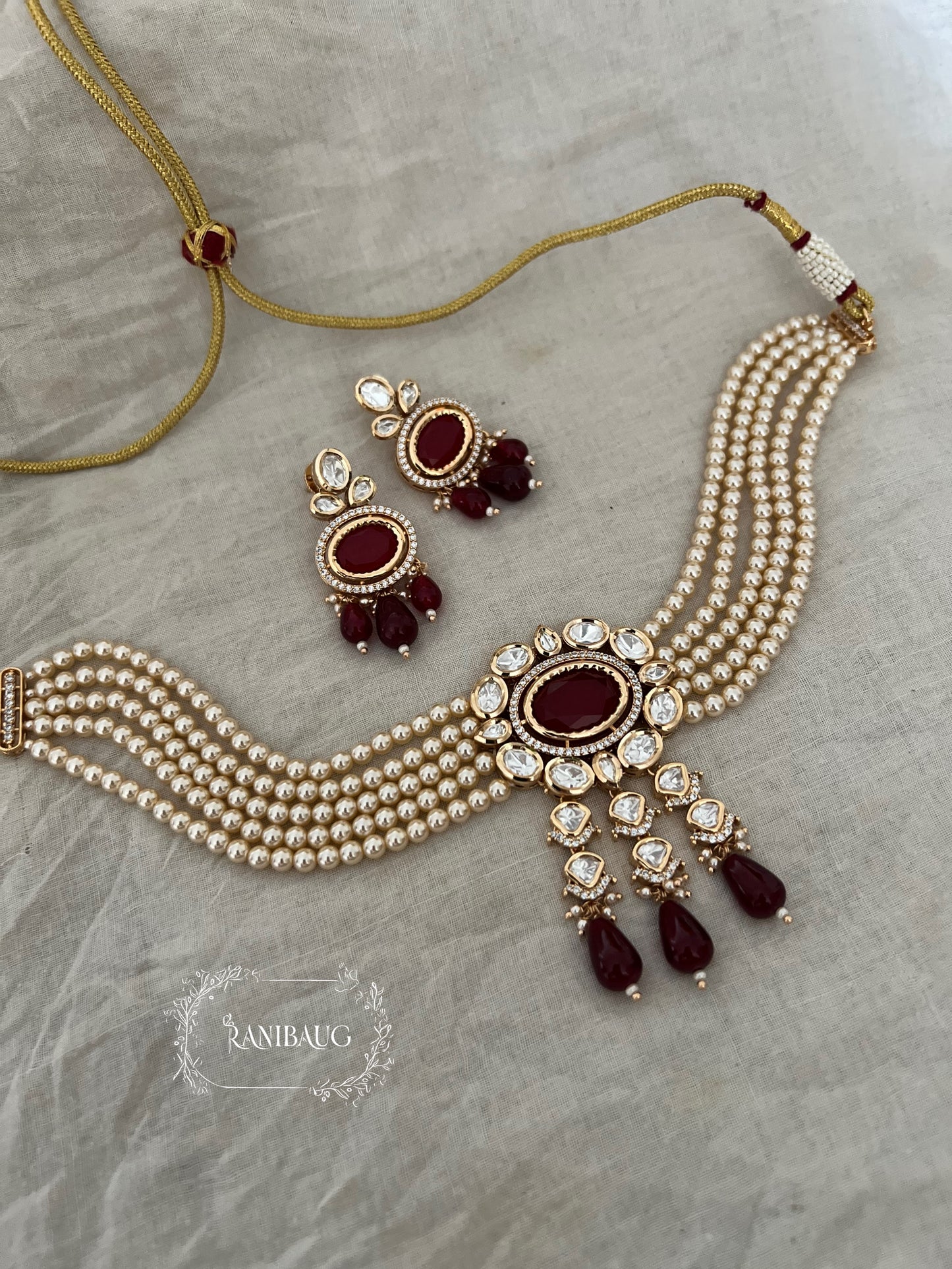 Samriddhi Gold Toned Polki And Pearl Choker With Oval Gemstone Motif Jewellery Set By Ranibaug