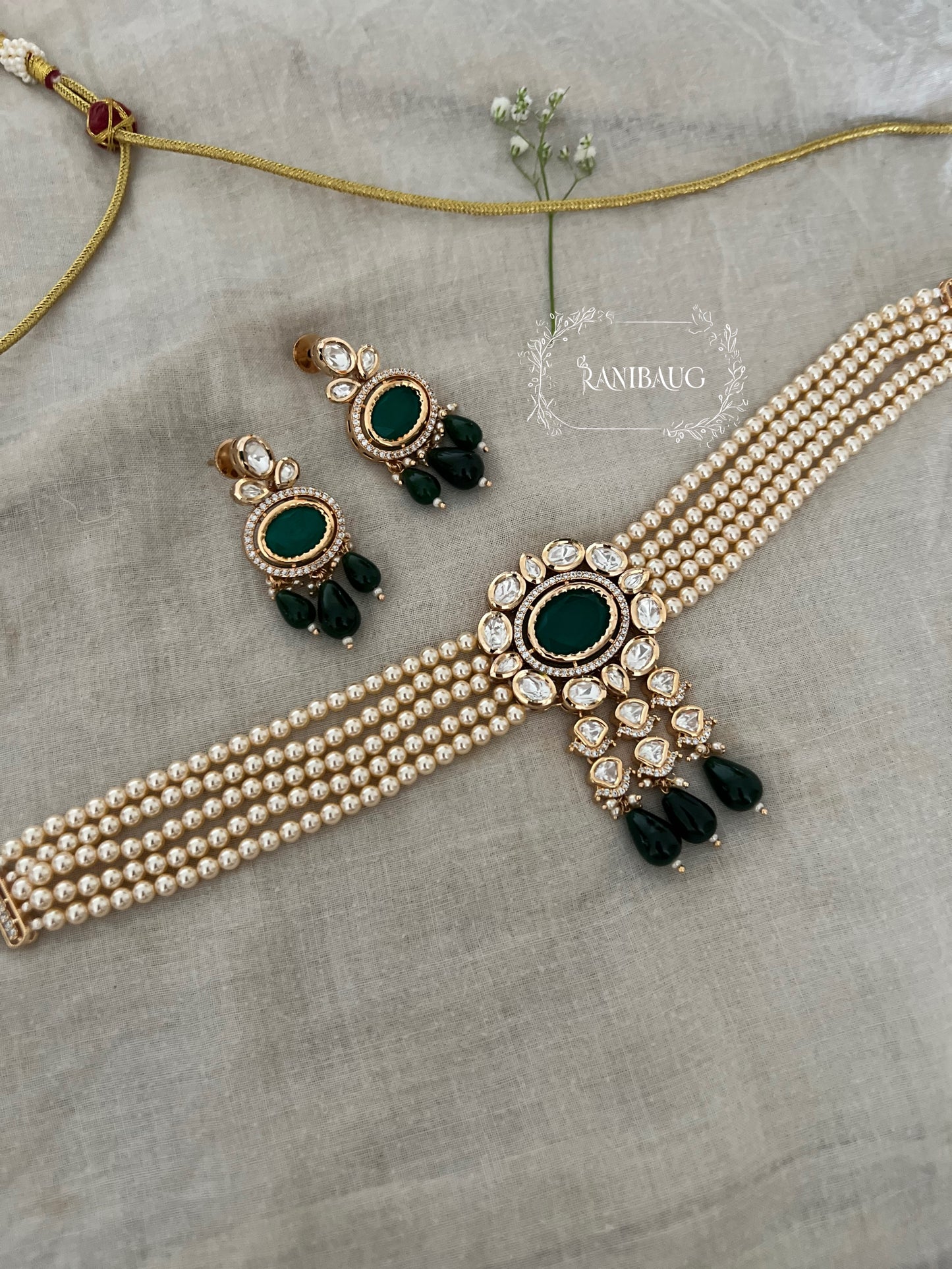 Samriddhi Gold Toned Polki And Pearl Choker With Oval Gemstone Motif Jewellery Set By Ranibaug