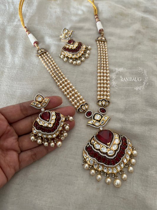 Sangharshi Queen's Heart Deep Red Ruby Adorned Polki Pearl Gold Finish Necklace Set By Ranibaug