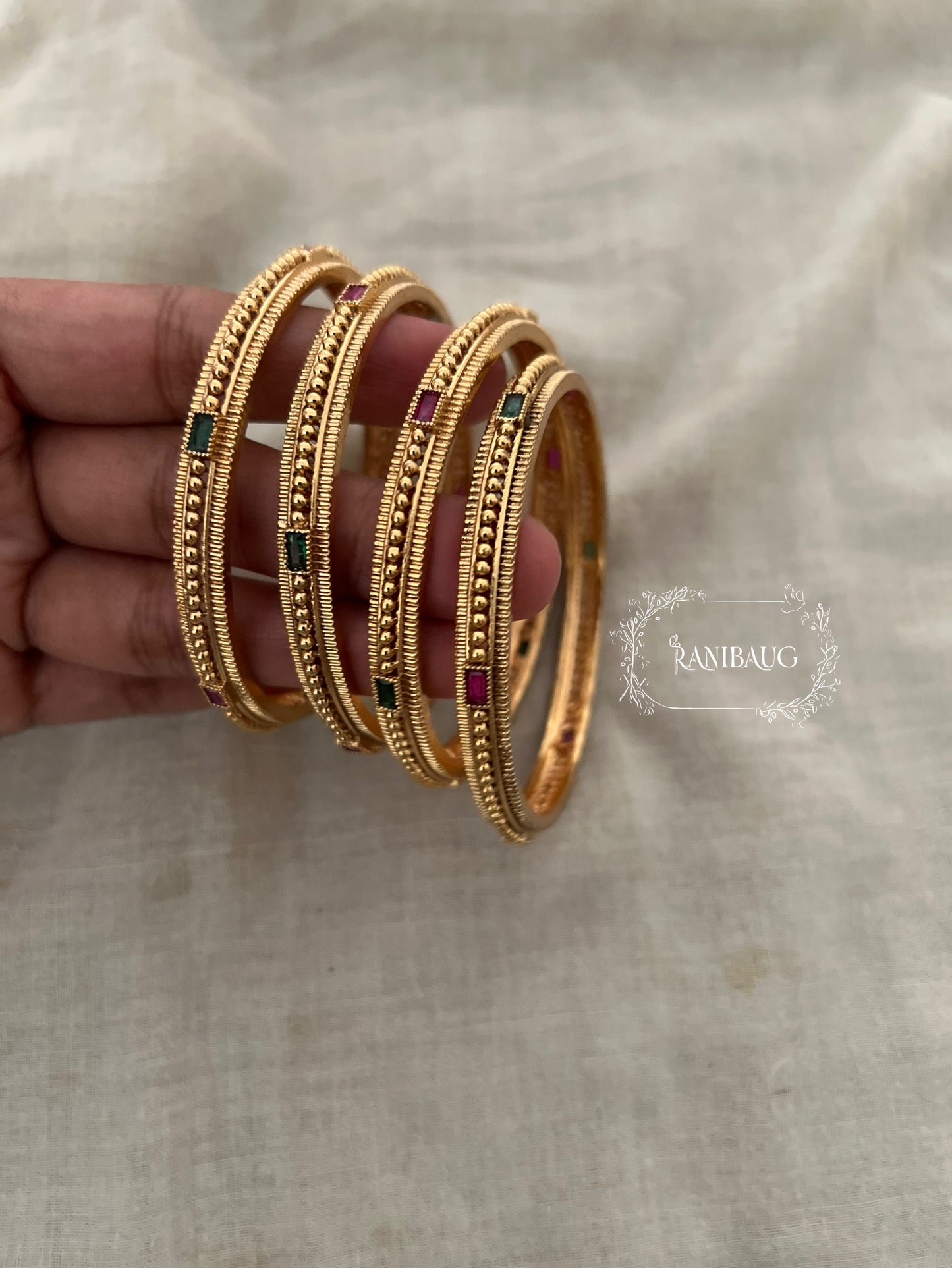 Shambhavi Dual Tone Gem Heritage Gold Bangles By Ranibaug (Set Of 4)