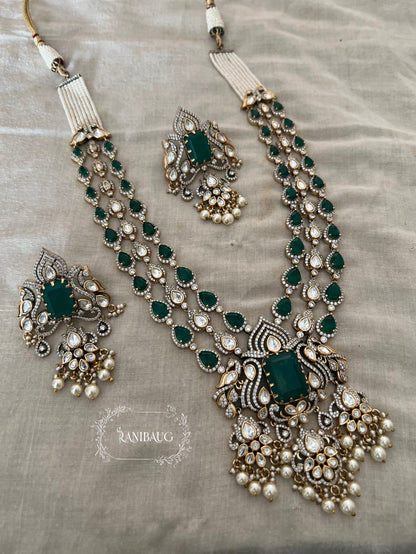 Sharanya Peacock Motif Victorian Finish Polki Kundan Studded Ruby And Emerald Color Long Necklace Set By Ranibaug | 3 Layered Necklace Set