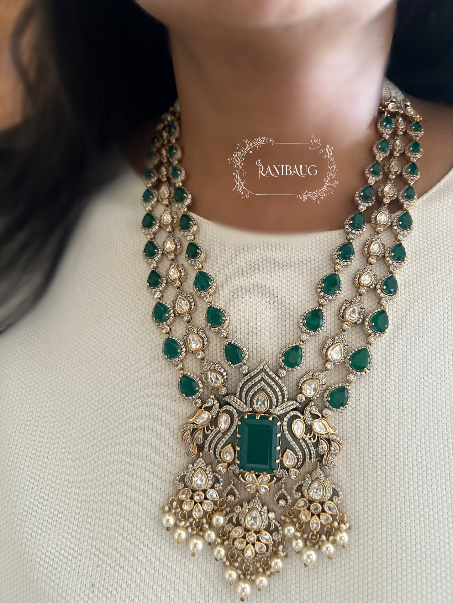 Sharanya Peacock Motif Victorian Finish Polki Kundan Studded Ruby And Emerald Color Long Necklace Set By Ranibaug | 3 Layered Necklace Set