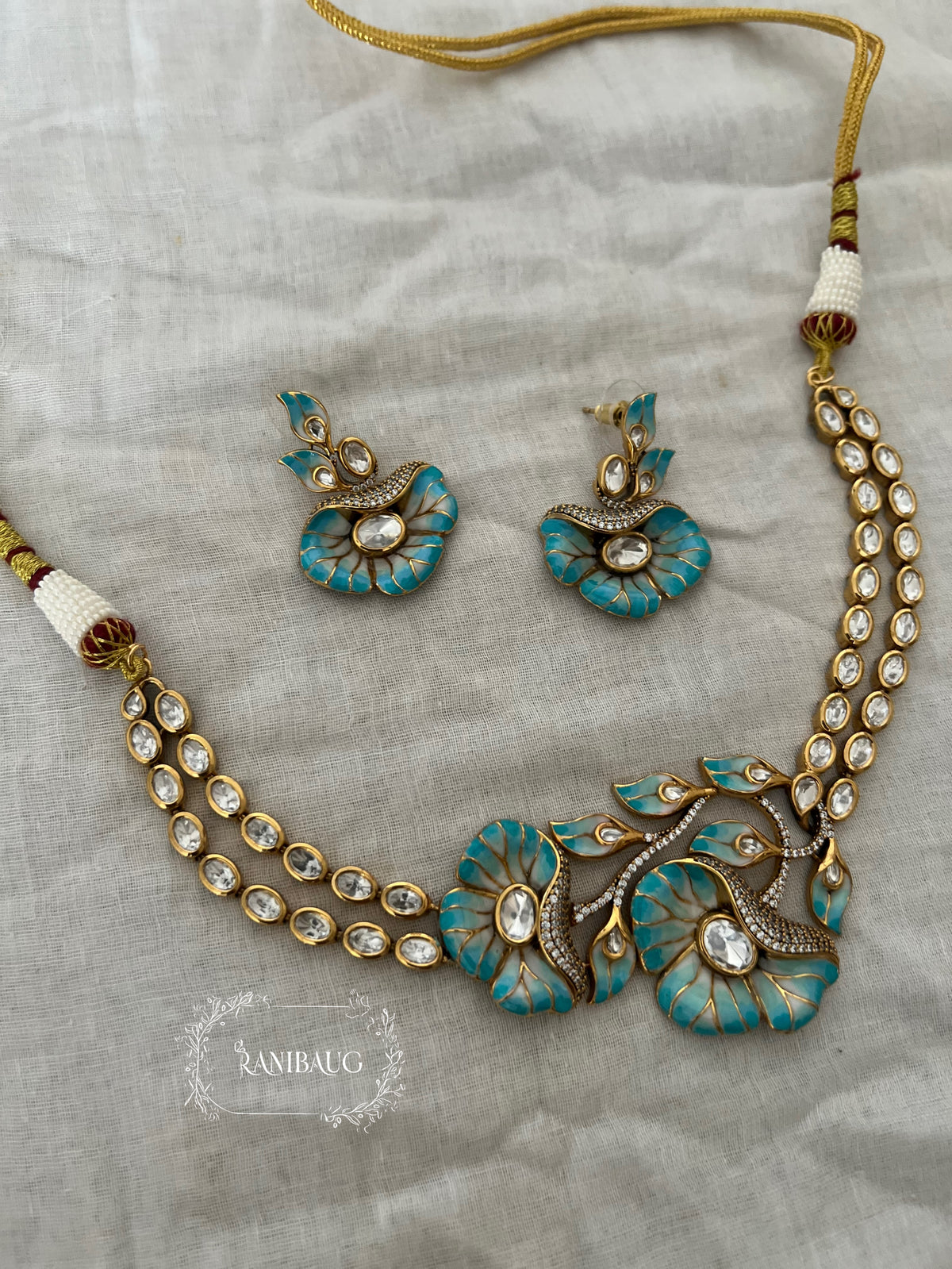 Shreshtha Enamel Floral Motif Polki Adorned Gold Finish Necklace Set By Ranibaug