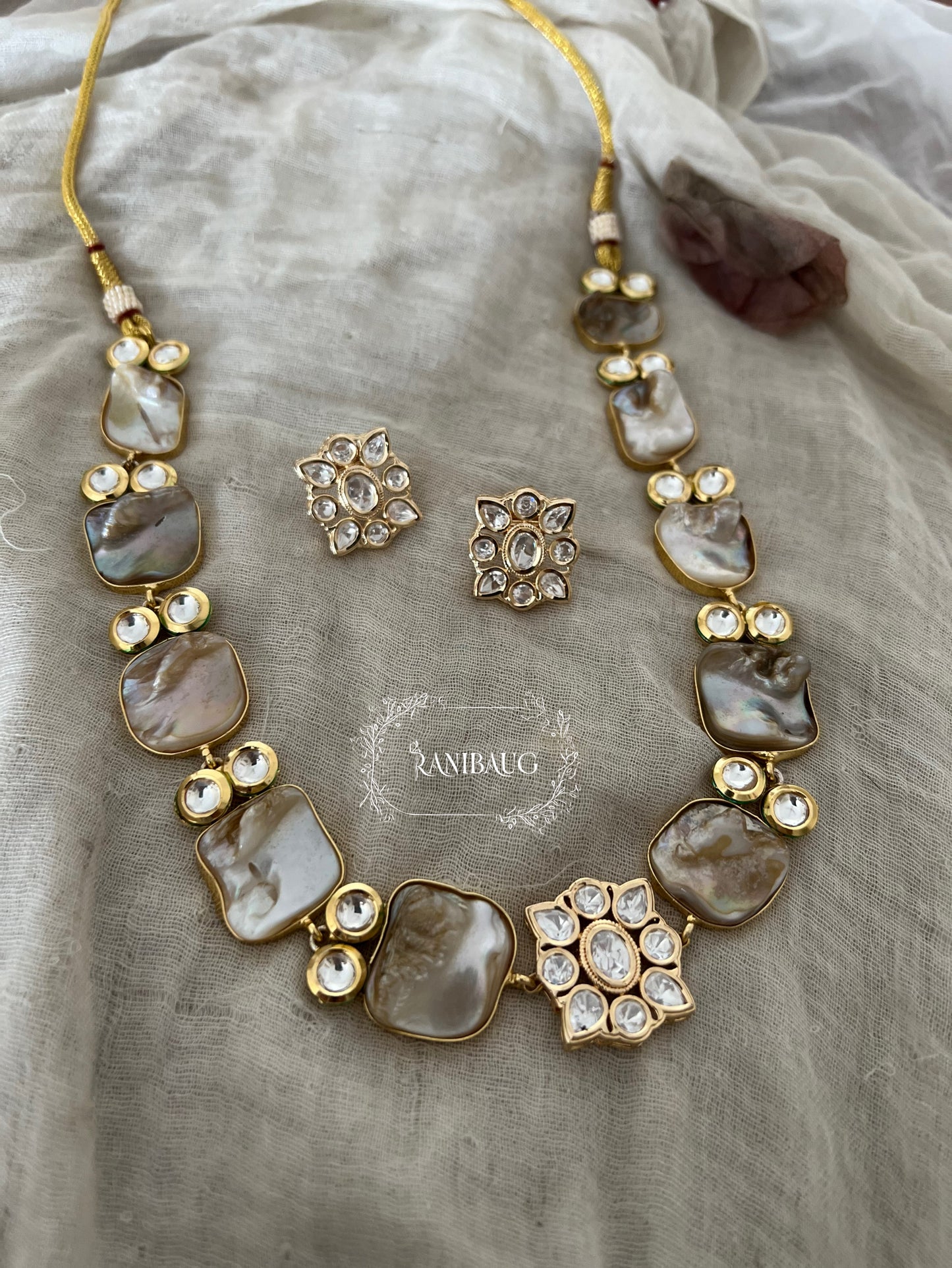 Soma Gold Plated Kundan Studded Semi Precious Necklace Set Featuring Real Baroque Pearl Motifs By Ranibaug