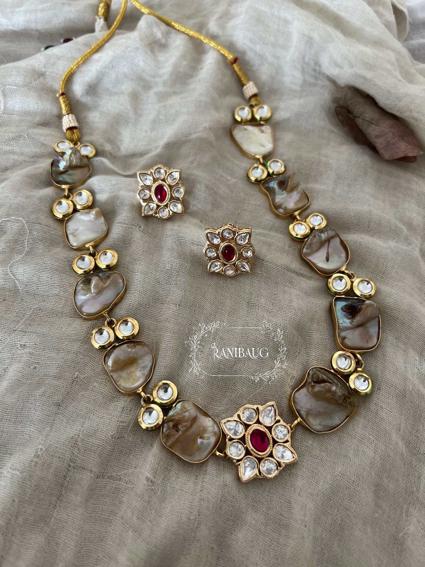 Soma Gold Plated Kundan Studded Semi Precious Necklace Set Featuring Real Baroque Pearl Motifs By Ranibaug