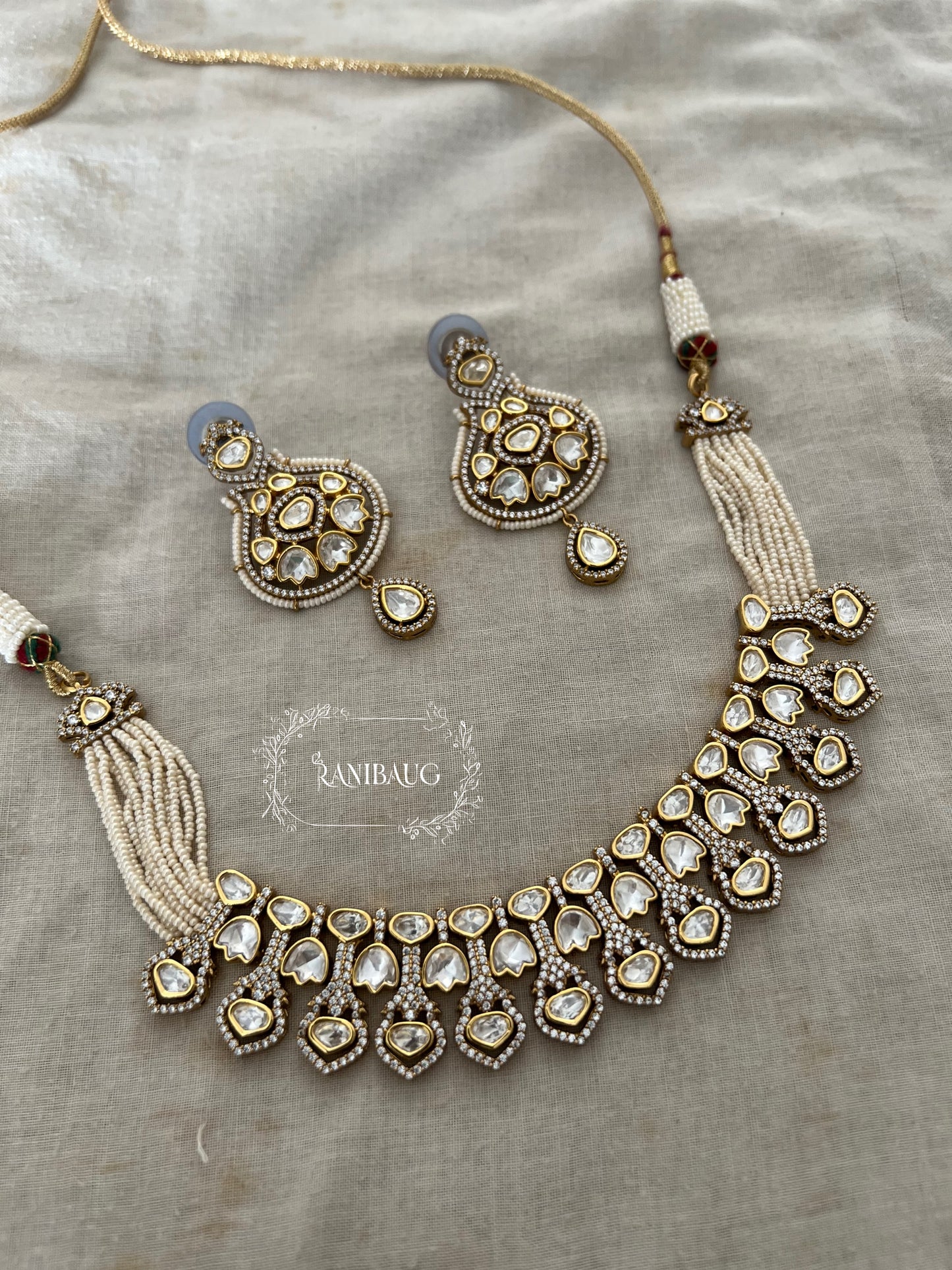 Tara Tulip Motifs Mossainite Polki Studded Beautiful Choker Necklace Set In Premium Gold Finish And Pear Strand Closure By Ranibaug