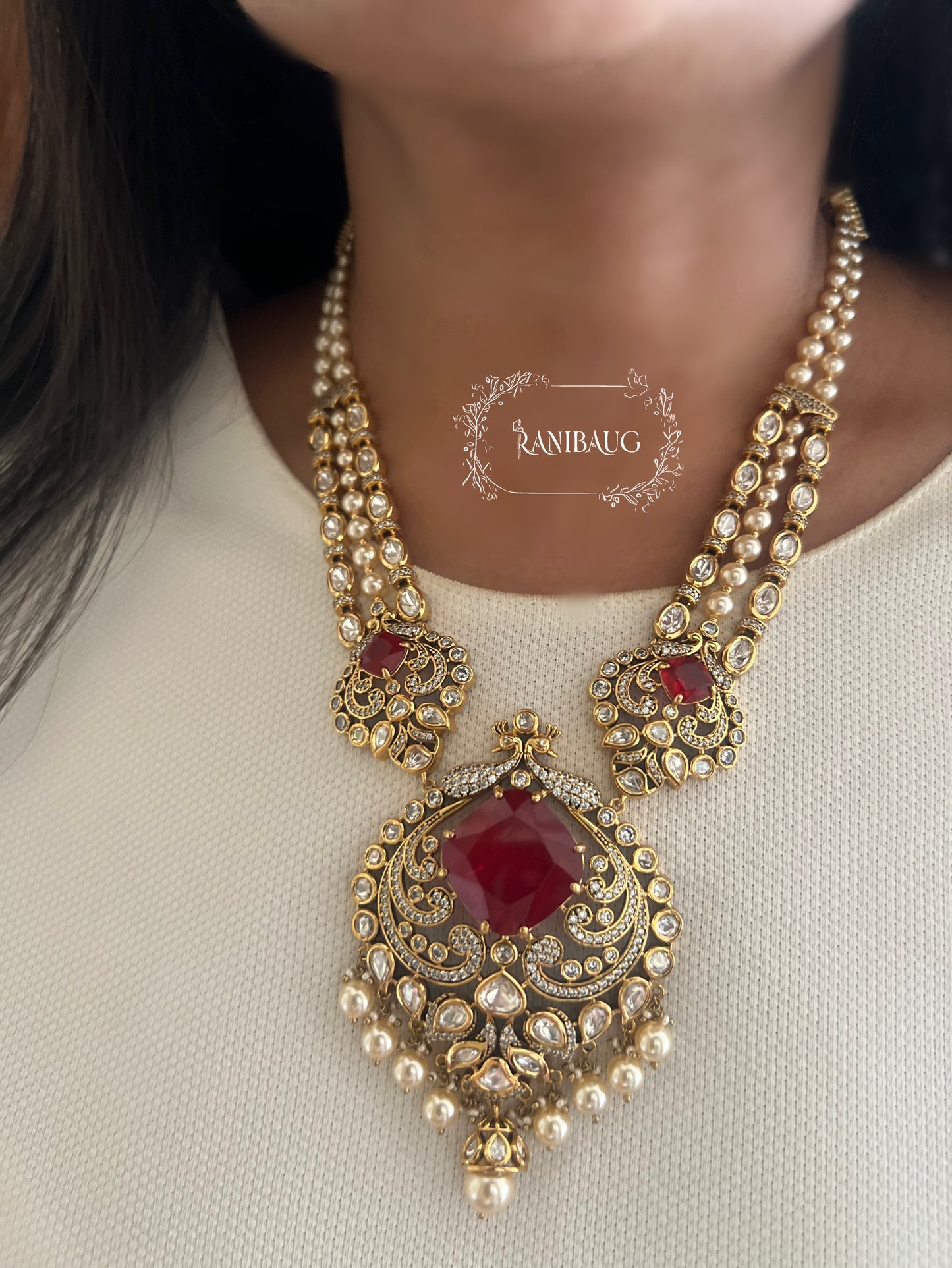 The Maharani’S Heirloom: Pearl Strand Necklace With Peacock Jadau Pendant | Emerald Green & Ruby Red Variants By Ranibaug