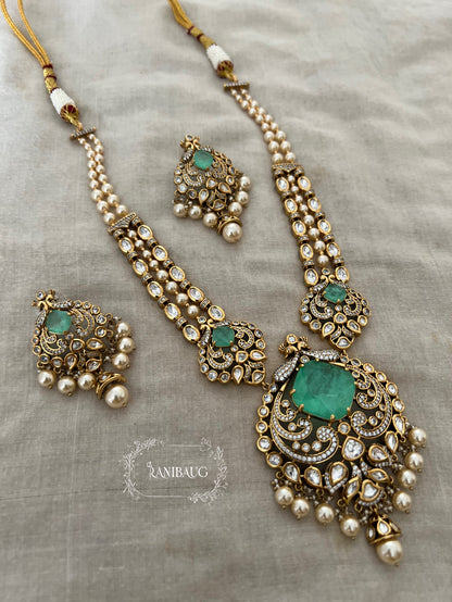 The Maharani’S Heirloom: Pearl Strand Necklace With Peacock Jadau Pendant | Emerald Green & Ruby Red Variants By Ranibaug