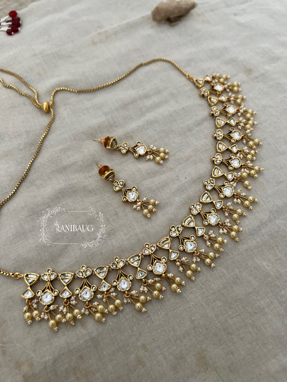 The Rukmini Rang-Mahal Polki Hourglass Necklace | Ruby & Emerald Geometric Fringe Set by Ranibaug