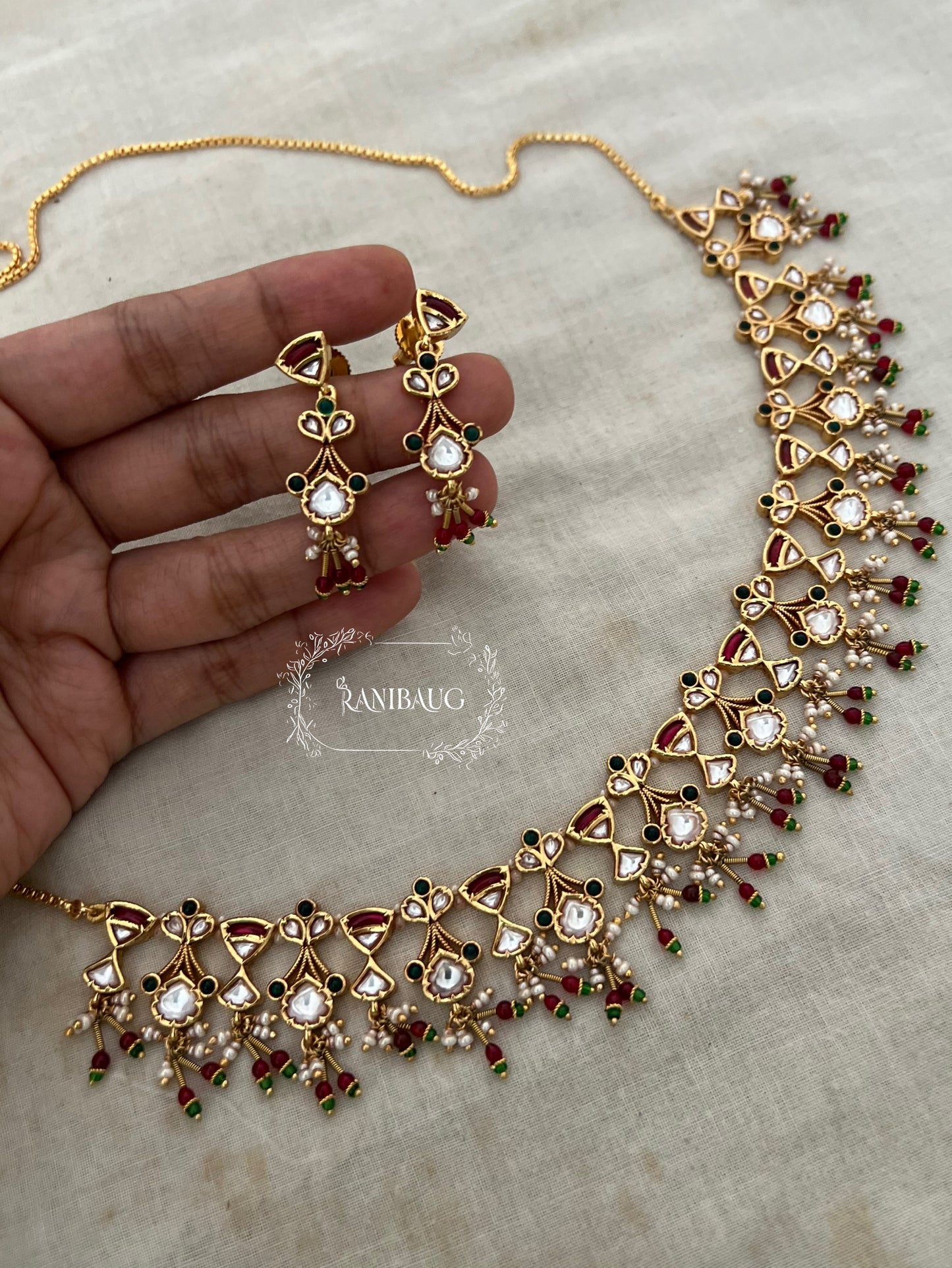 The Rukmini Rang-Mahal Polki Hourglass Necklace | Ruby & Emerald Geometric Fringe Set by Ranibaug