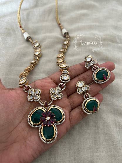 Verya Clover Leaf Inspired Emerald Ruby And Polki Adorned In Premium Gold Finish Designer Jewellery Set By Ranibaug