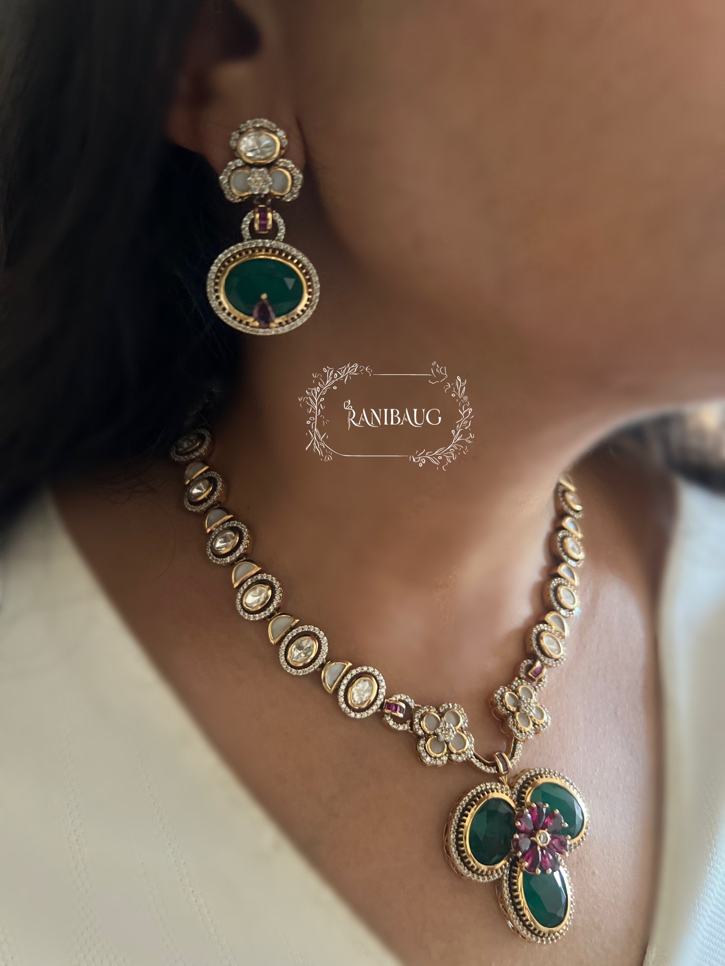 Verya Clover Leaf Inspired Emerald Ruby And Polki Adorned In Premium Gold Finish Designer Jewellery Set By Ranibaug