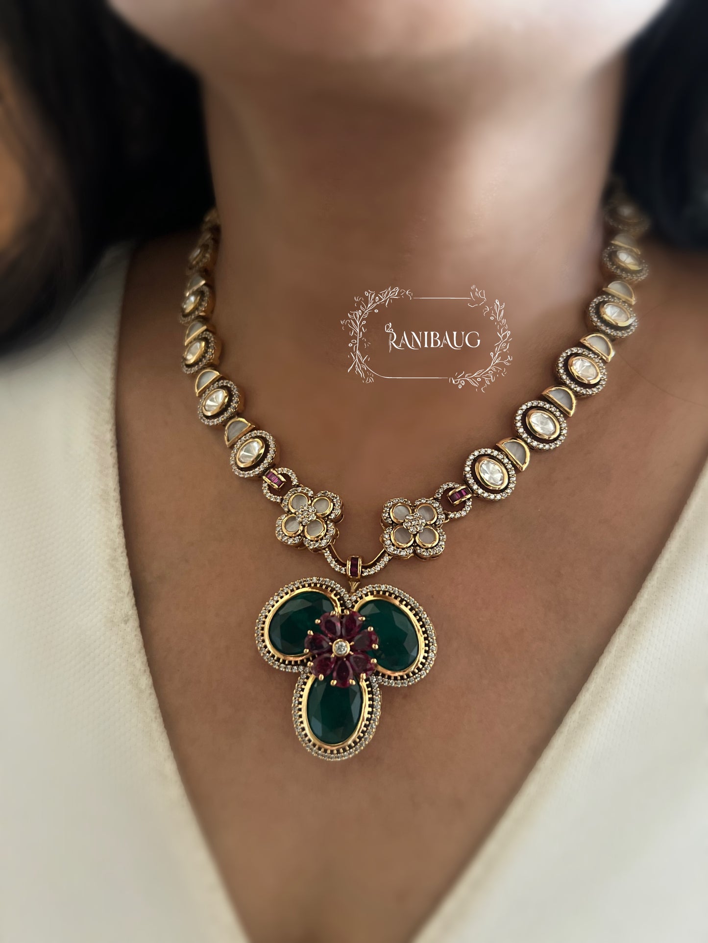 Verya Clover Leaf Inspired Emerald Ruby And Polki Adorned In Premium Gold Finish Designer Jewellery Set By Ranibaug