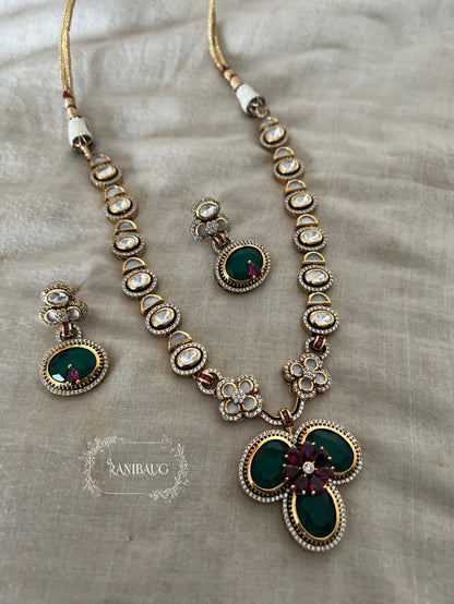 Verya Clover Leaf Inspired Emerald Ruby And Polki Adorned In Premium Gold Finish Designer Jewellery Set By Ranibaug