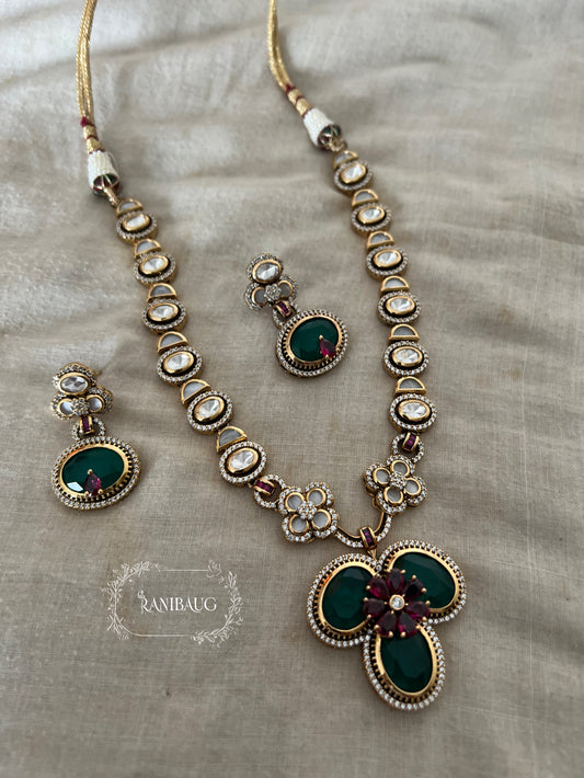 Verya Clover Leaf Inspired Emerald Ruby And Polki Adorned In Premium Gold Finish Designer Jewellery Set By Ranibaug
