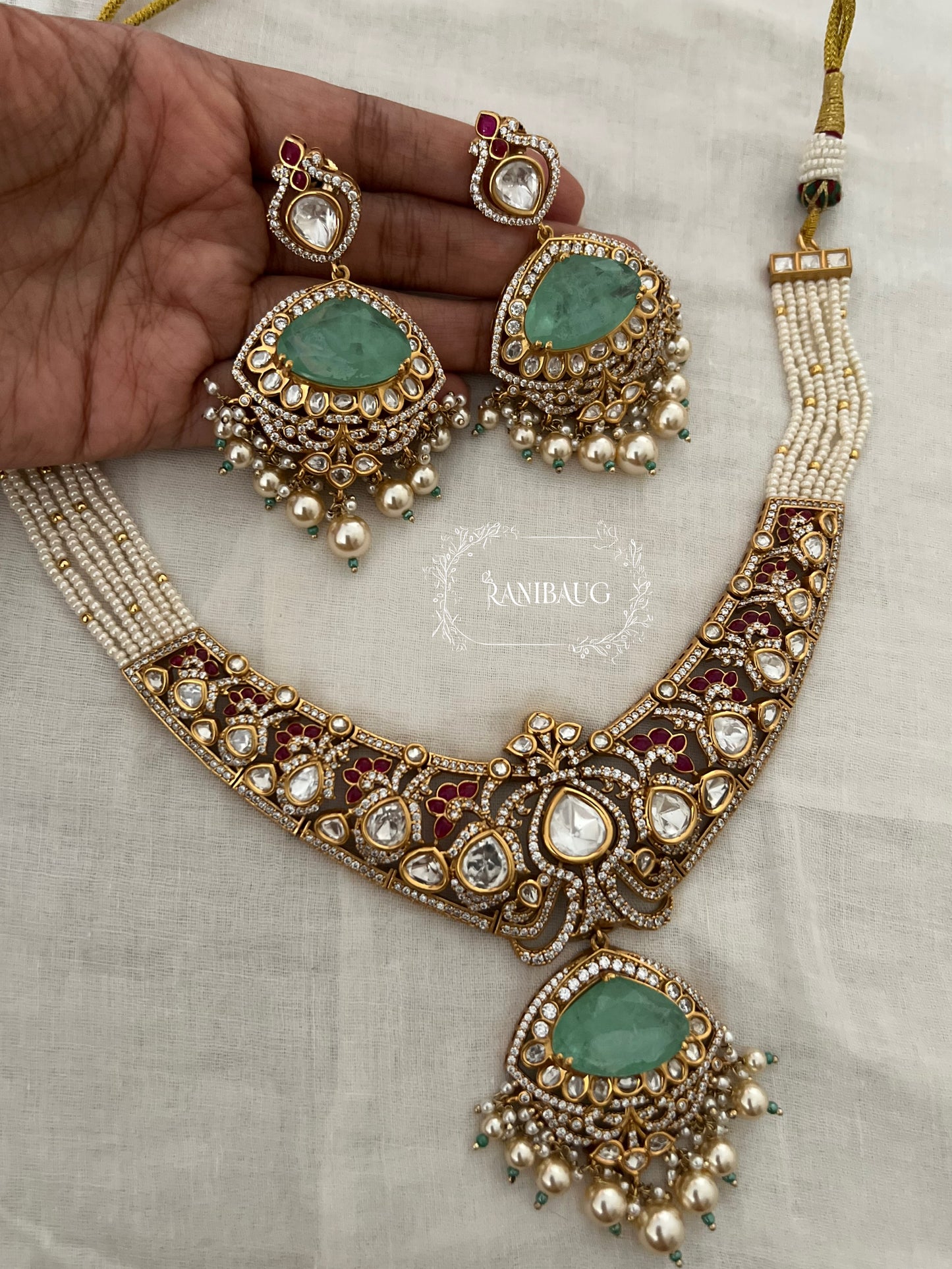 Vrushita Rich Gold Finish Polki Kundan Studded Pearl Adorned Royal Jewellery Set By Ranibaug