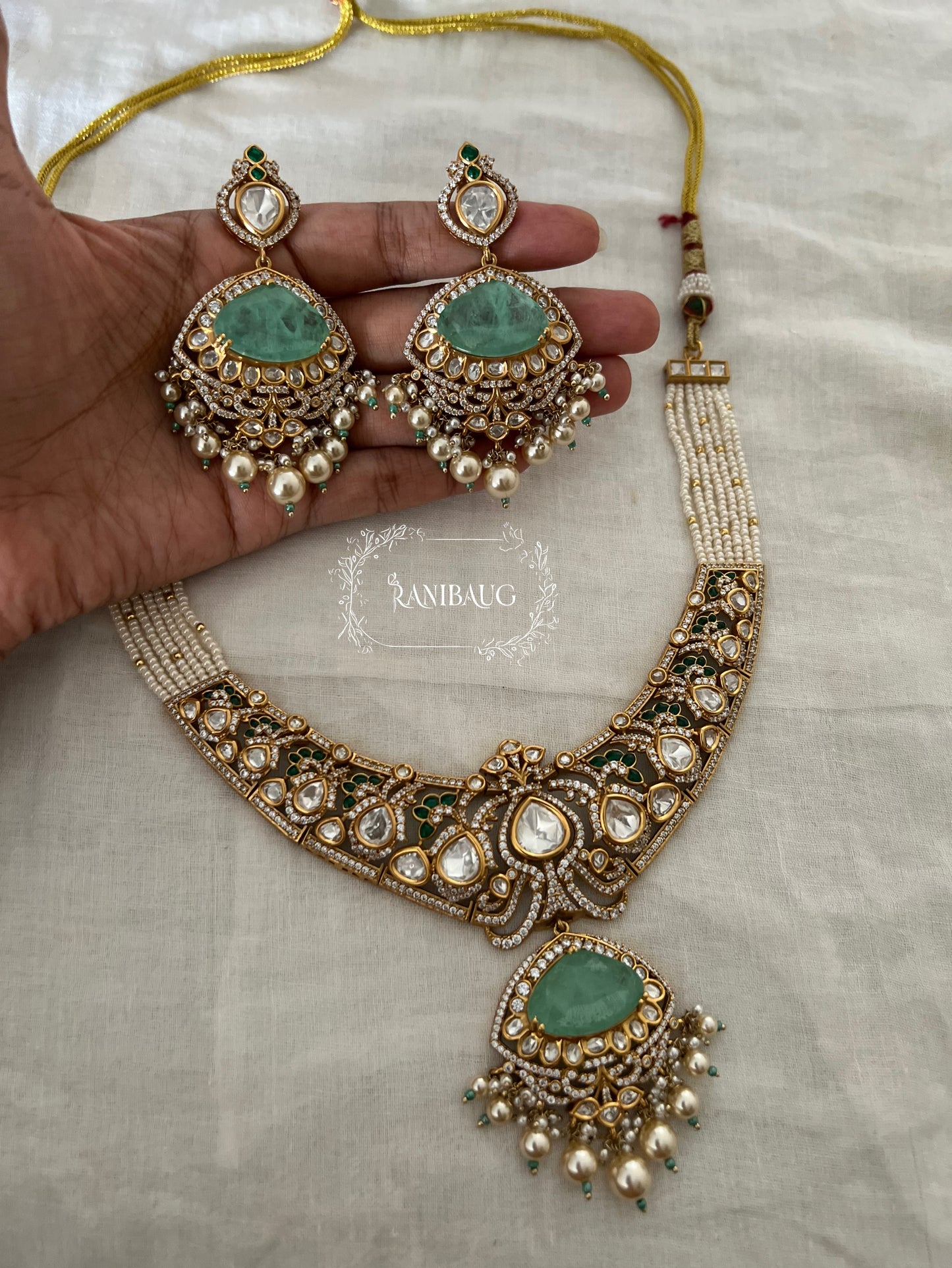 Vrushita Rich Gold Finish Polki Kundan Studded Pearl Adorned Royal Jewellery Set By Ranibaug