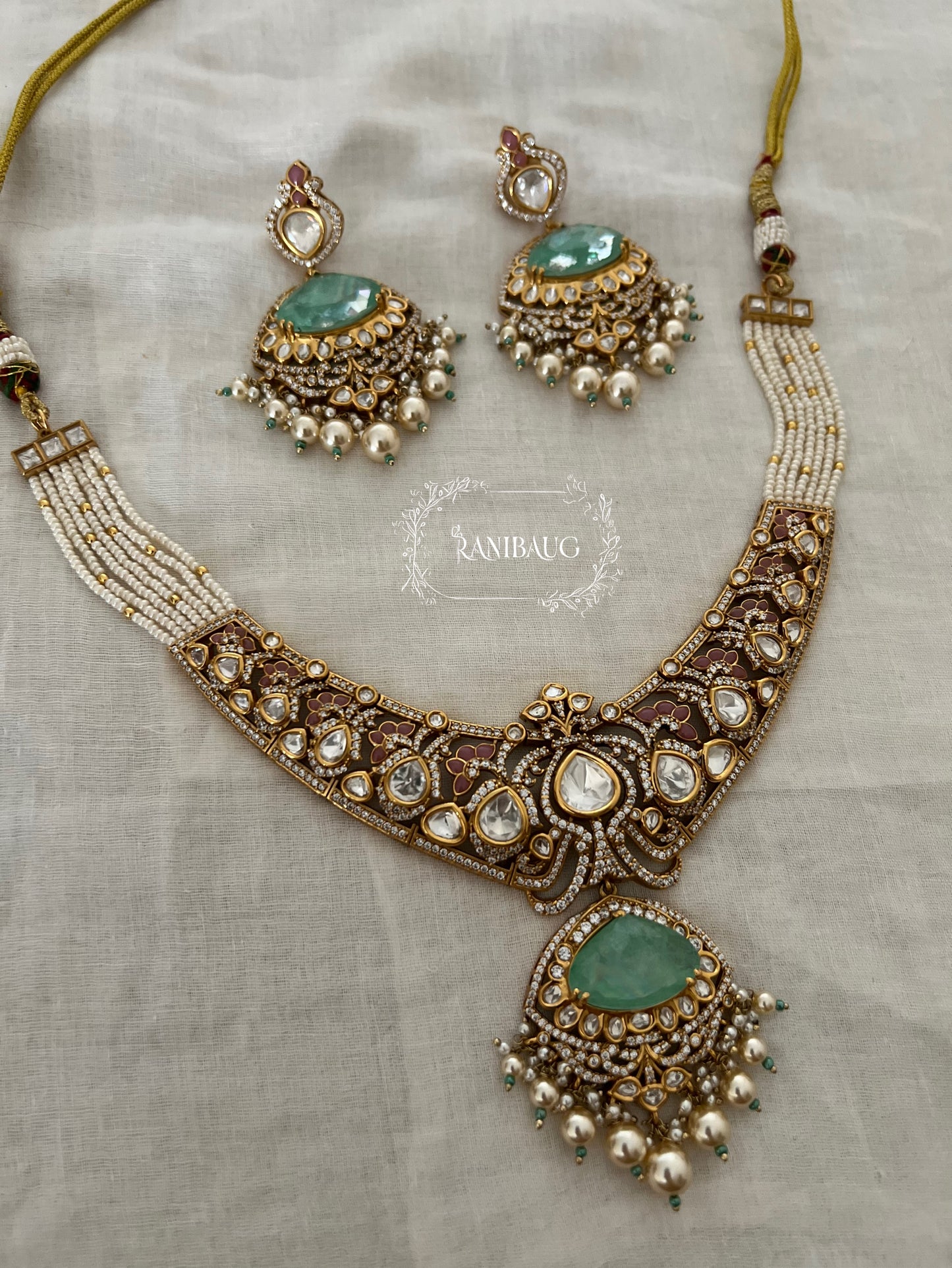 Vrushita Rich Gold Finish Polki Kundan Studded Pearl Adorned Royal Jewellery Set By Ranibaug