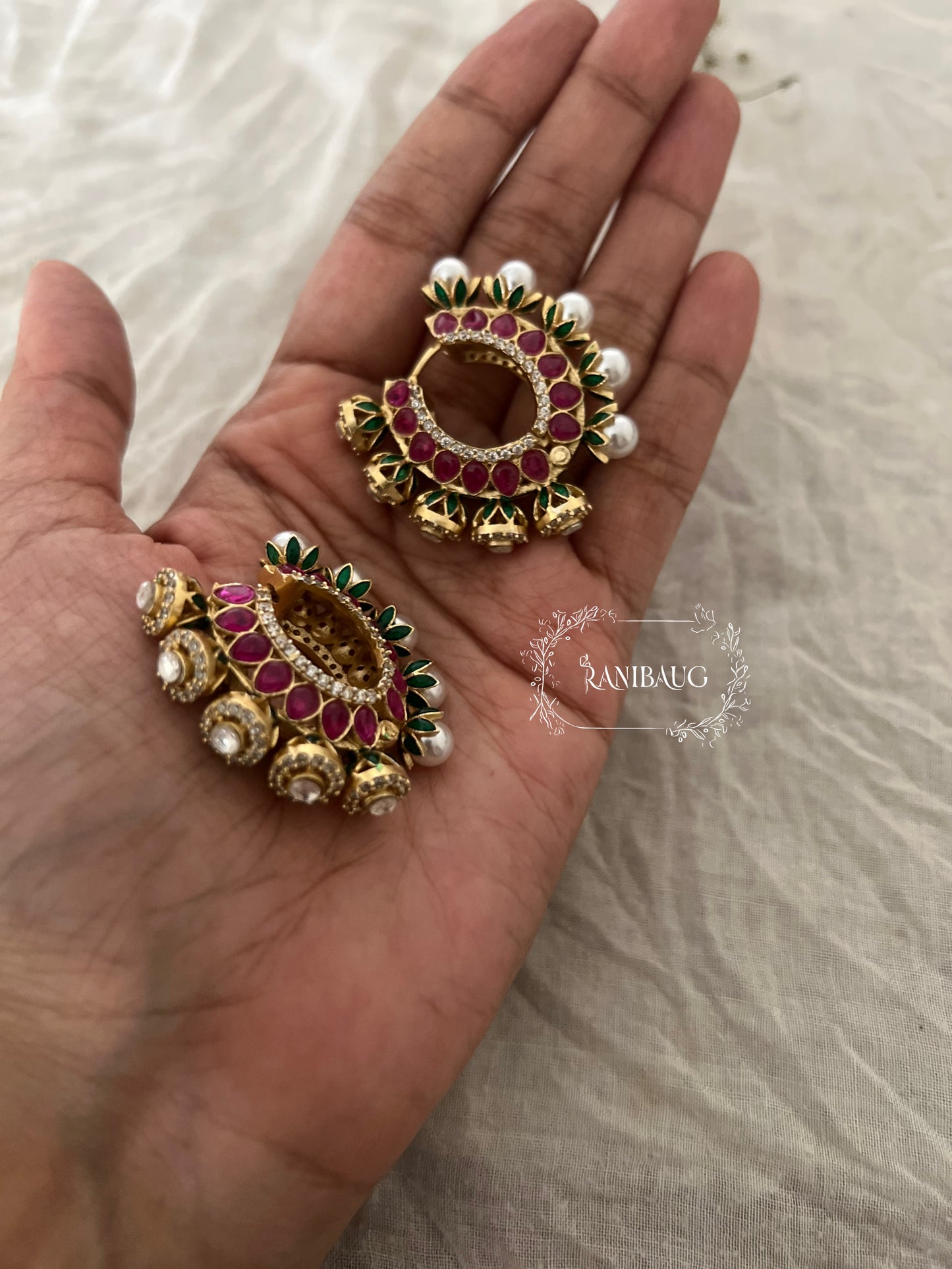 Zalak Polki Studded Gold Finish Pearl Adorned Emerald Ruby Accents Hoop Designer Earrings By Ranibaug