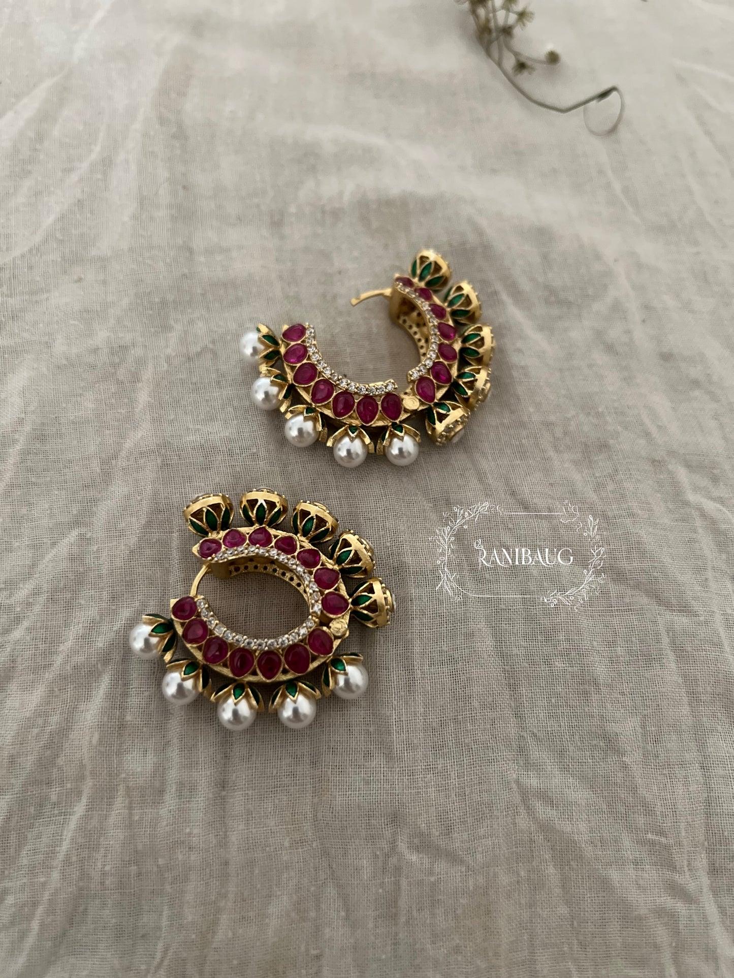 Zalak Polki Studded Gold Finish Pearl Adorned Emerald Ruby Accents Hoop Designer Earrings By Ranibaug
