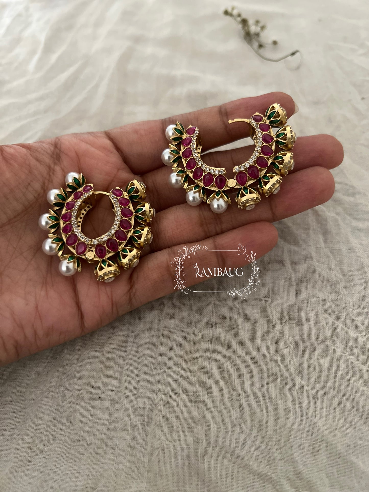 Zalak Polki Studded Gold Finish Pearl Adorned Emerald Ruby Accents Hoop Designer Earrings By Ranibaug